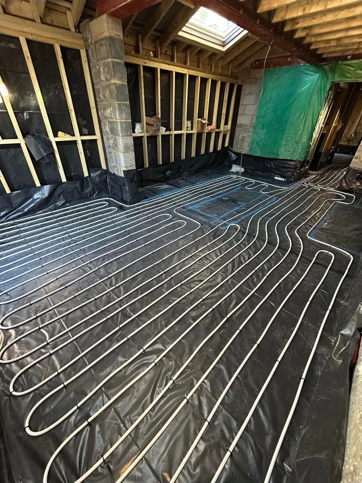 Underfloor heating loops clipped down ready for screed